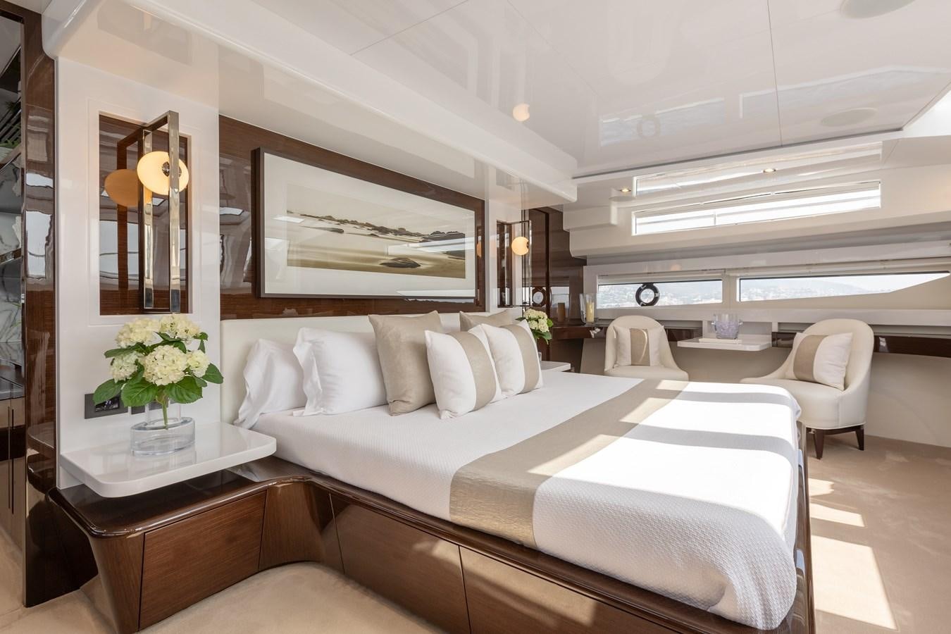 a room with a bed and a table aboard THETIS Yacht for Sale