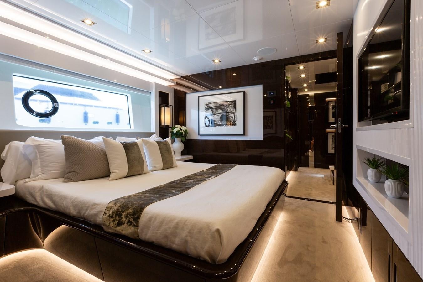 a large bed in a room aboard THETIS Yacht for Sale