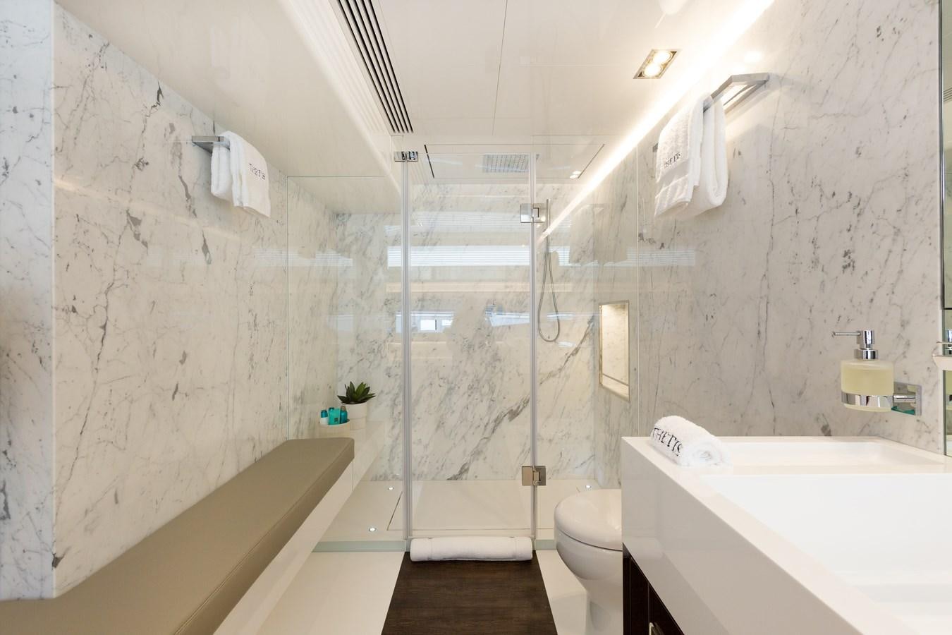 a bathroom with a shower and sink aboard THETIS Yacht for Sale