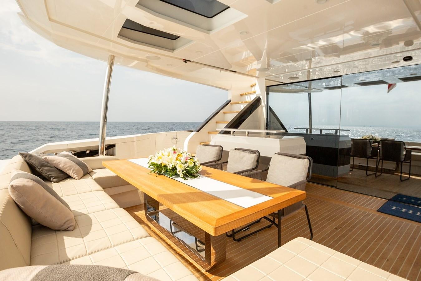 a room with a table and chairs aboard THETIS Yacht for Sale