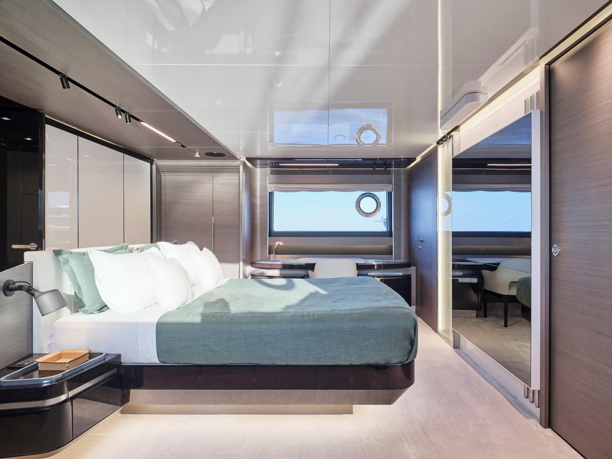 a room with a bed and a desk aboard D FIVE Yacht for Sale
