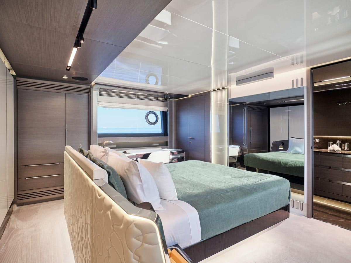 a room with a bed and a television aboard D FIVE Yacht for Sale