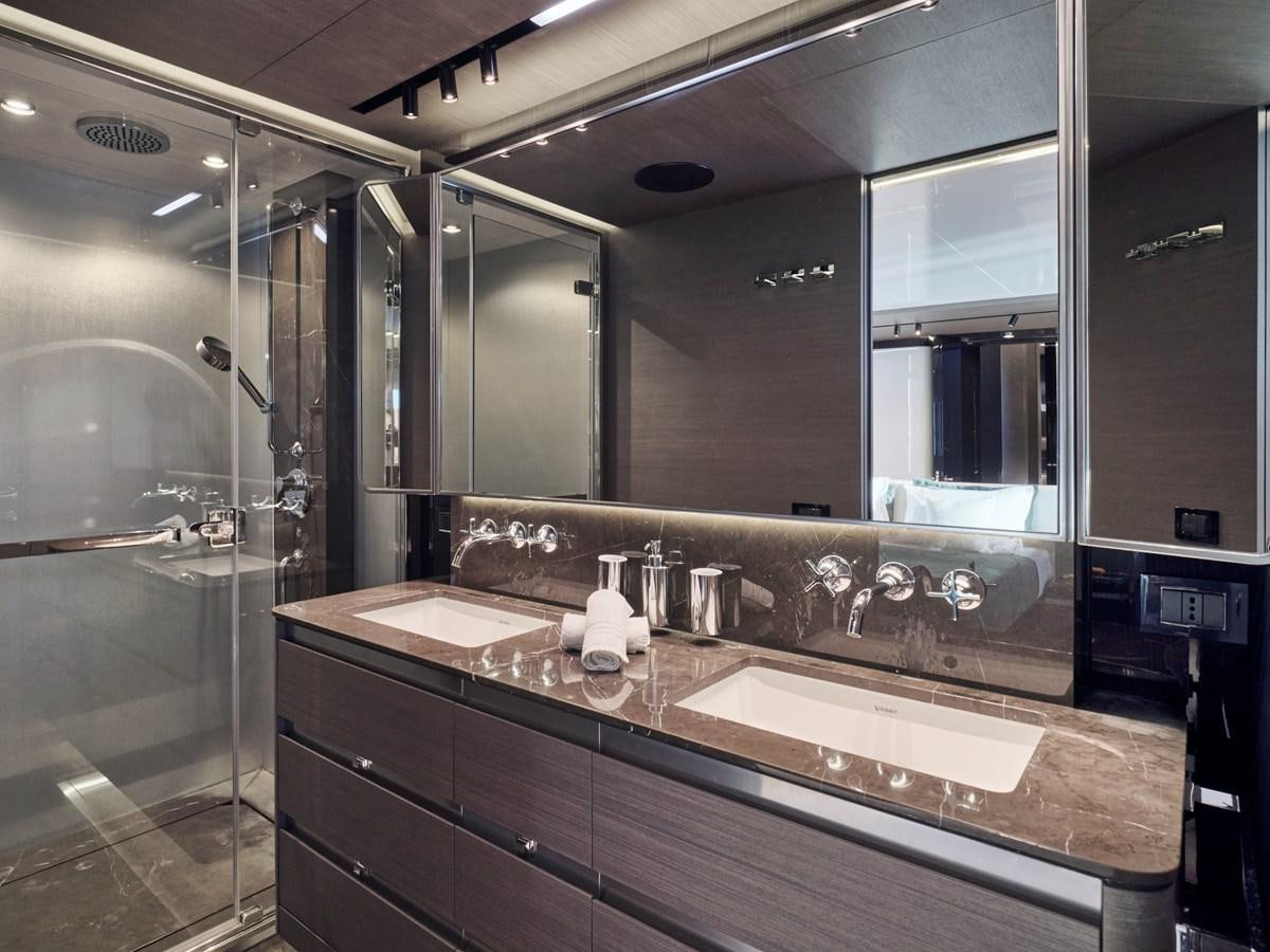 a bathroom with a large mirror aboard D FIVE Yacht for Sale