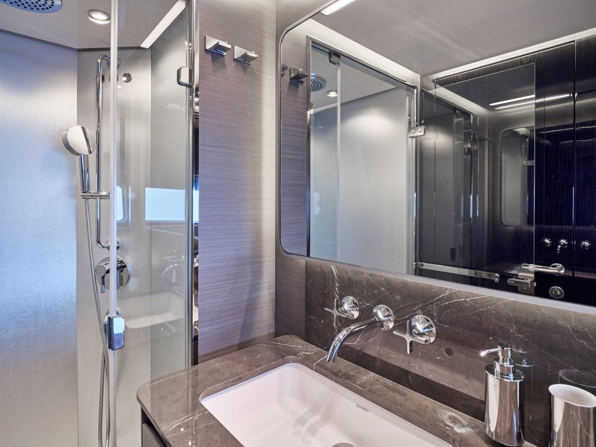 a bathroom with a glass shower aboard D FIVE Yacht for Sale