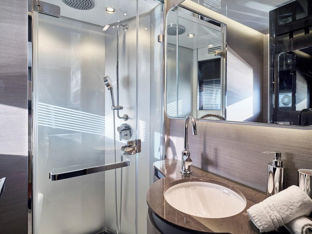 a bathroom with a glass shower aboard D FIVE Yacht for Sale