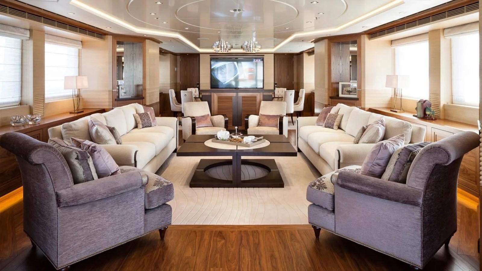 a living room with a large screen aboard ELENA Yacht for Sale