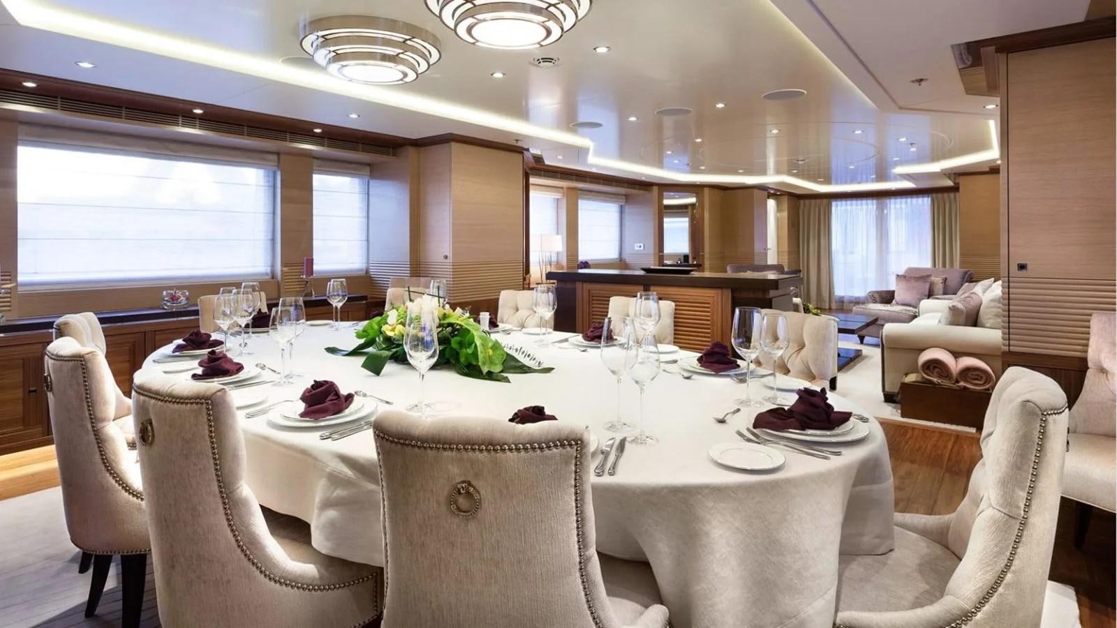 a dining room with a table set aboard ELENA Yacht for Sale