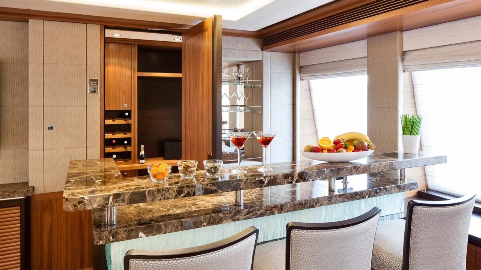 a table with glasses and food on it aboard ELENA Yacht for Sale