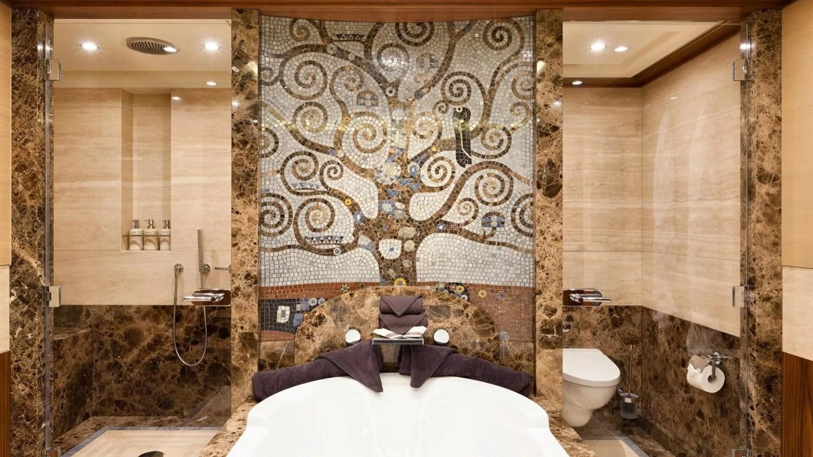 a bathroom with a bed and a mirror aboard ELENA Yacht for Sale