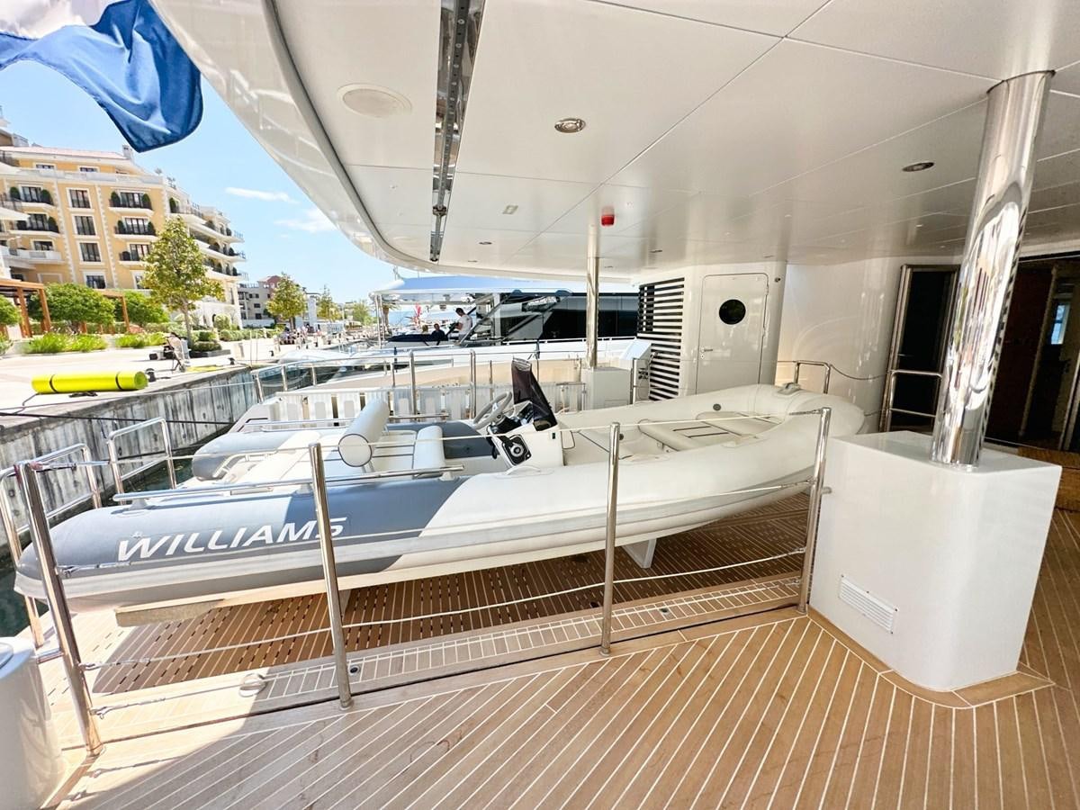 a large white boat on a deck aboard SHU U RITE Yacht for Sale