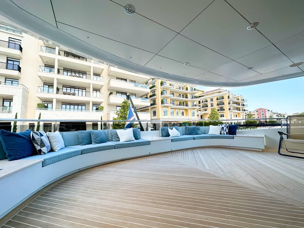 a large lounge area with a pool and lounge chairs aboard SHU U RITE Yacht for Sale