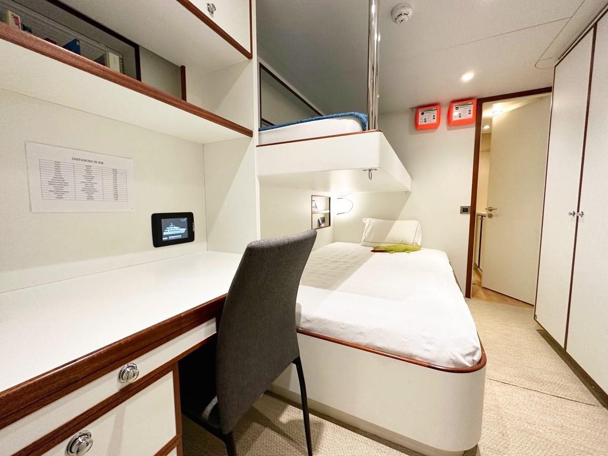 a room with a desk and a bed aboard SHU U RITE Yacht for Sale