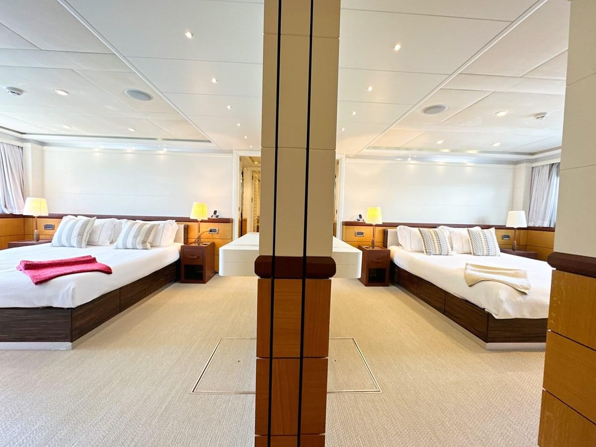 a large room with a bed and a large mirror aboard SHU U RITE Yacht for Sale