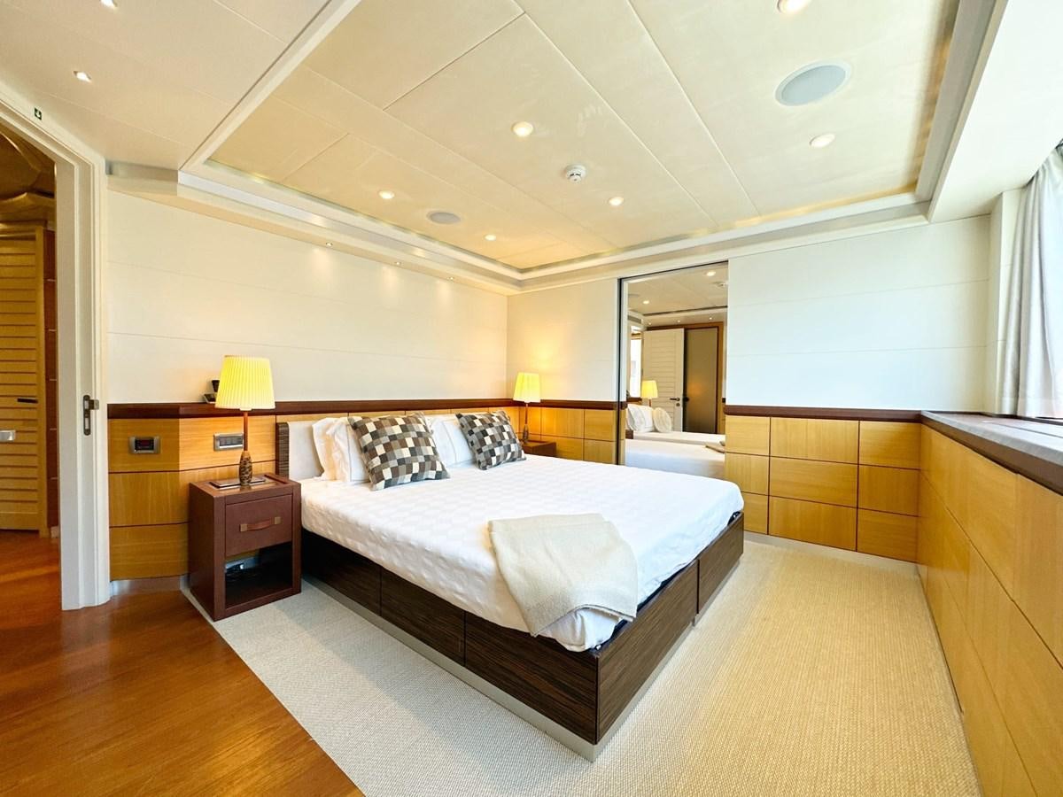 a large bedroom with a large bed aboard SHU U RITE Yacht for Sale