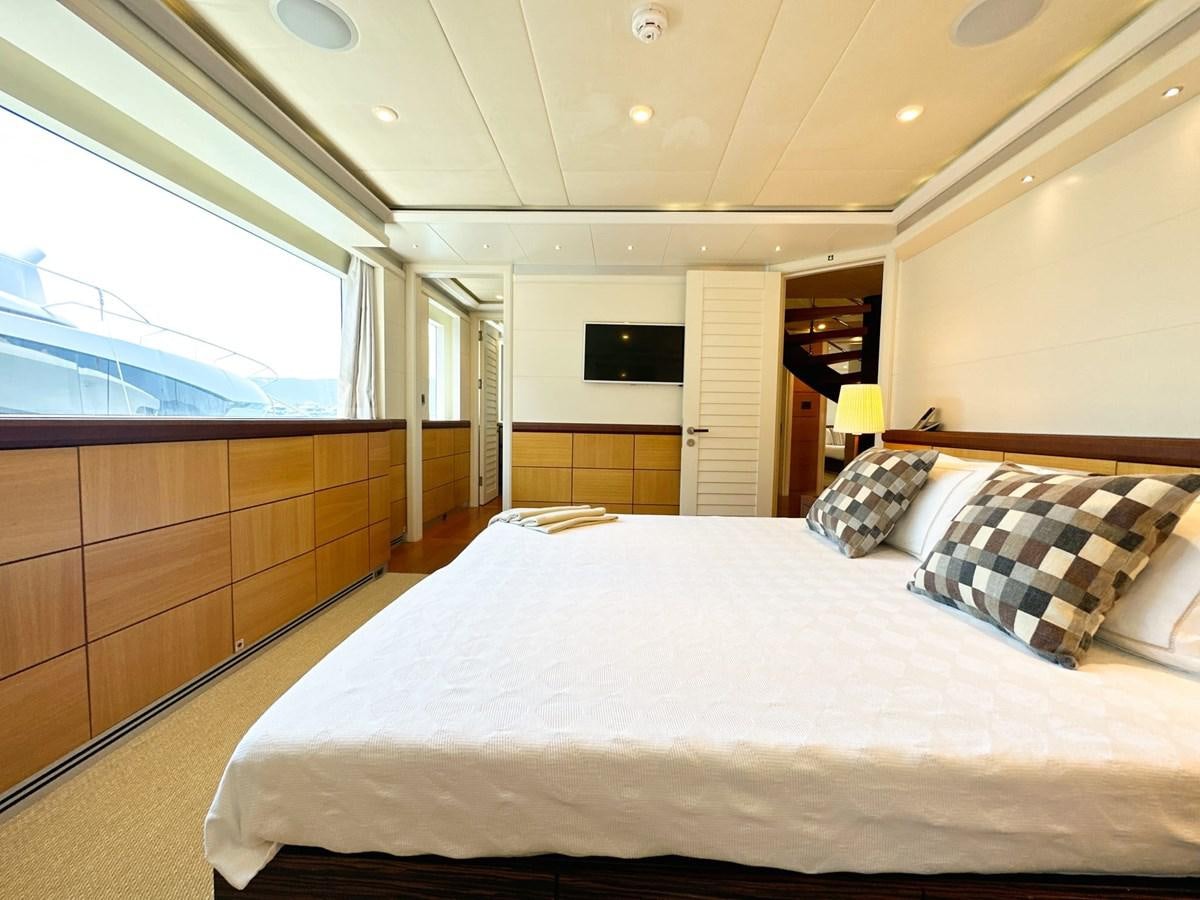 a large bedroom with a large bed aboard SHU U RITE Yacht for Sale