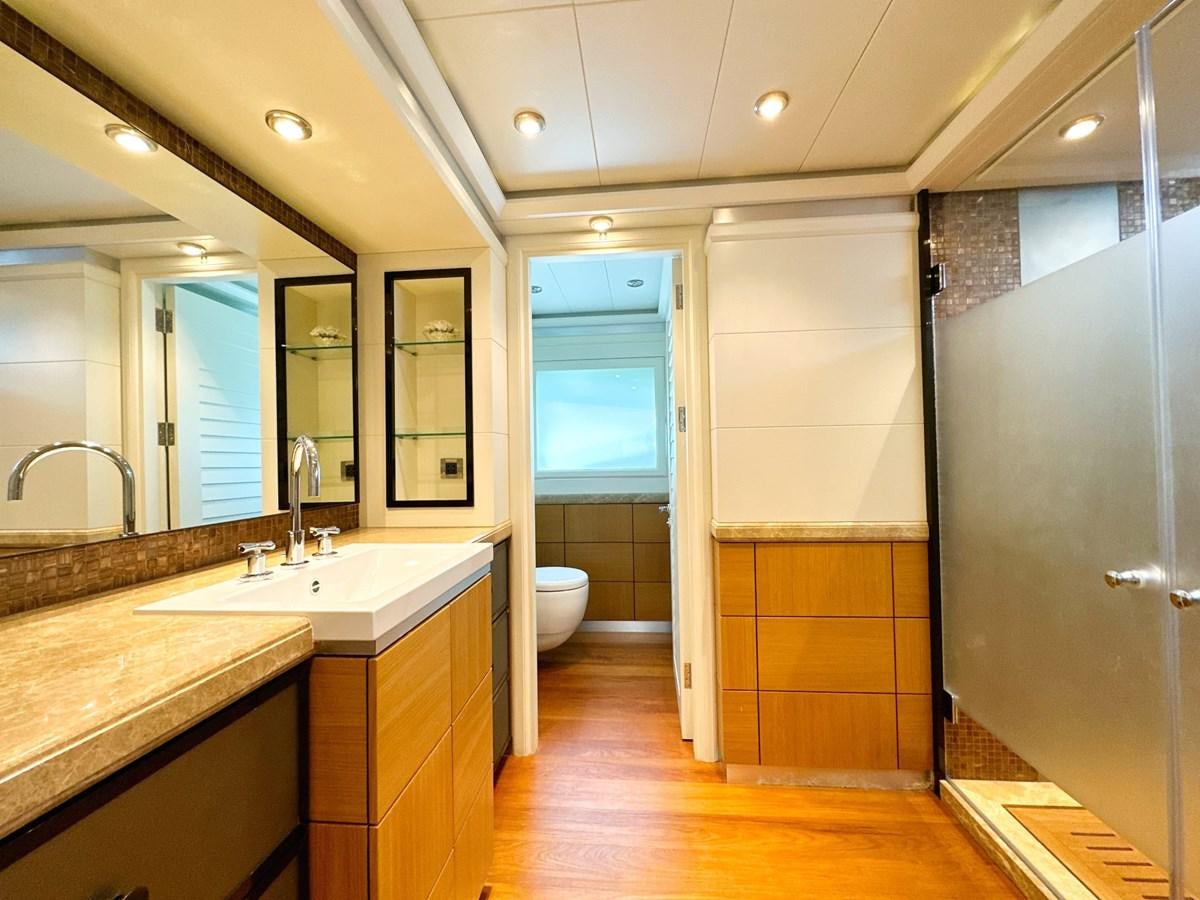 a bathroom with a large mirror aboard SHU U RITE Yacht for Sale