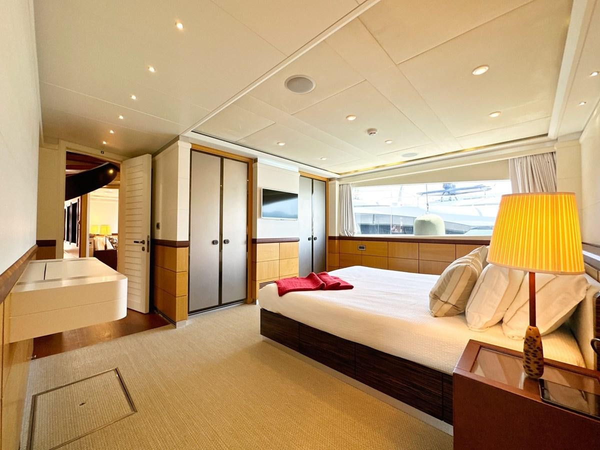 a bedroom with a large bed aboard SHU U RITE Yacht for Sale