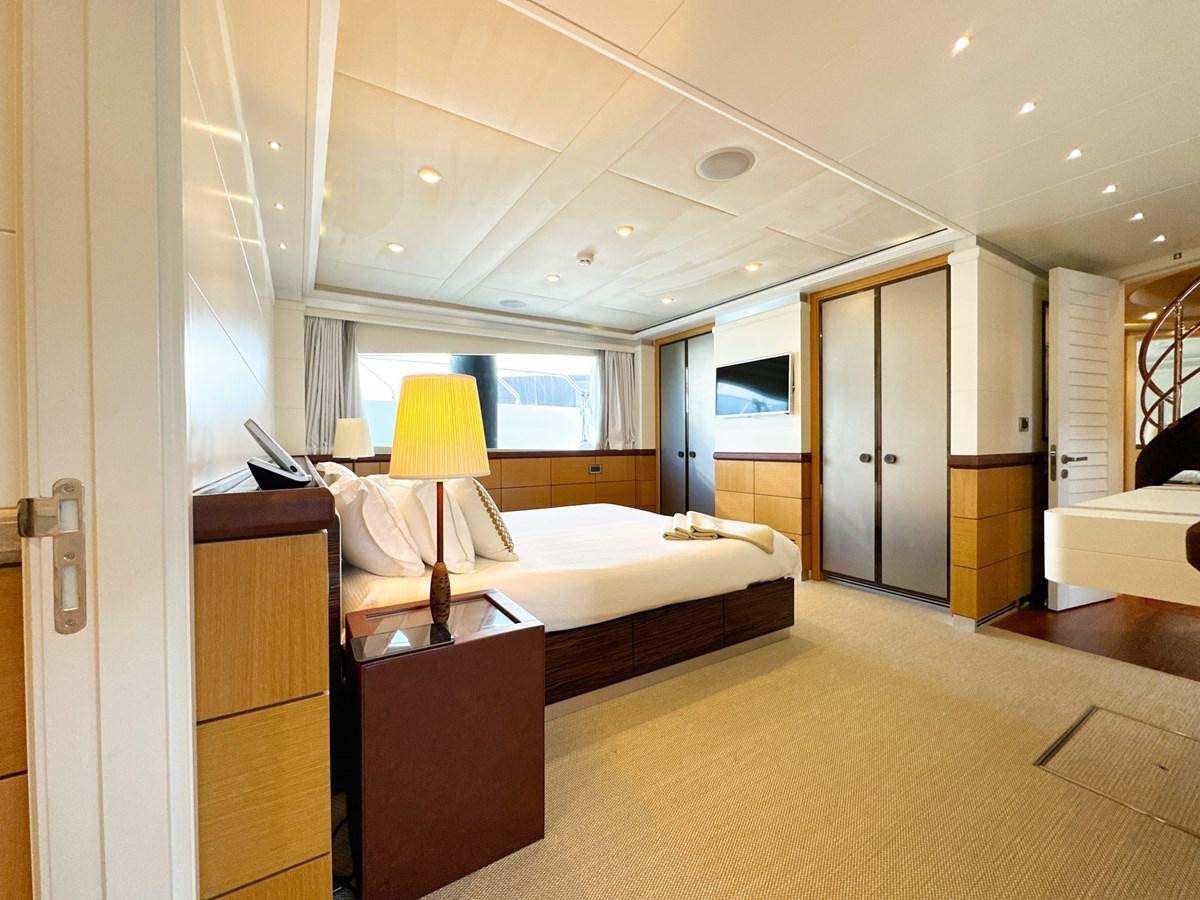 a room with a bed and a desk aboard SHU U RITE Yacht for Sale