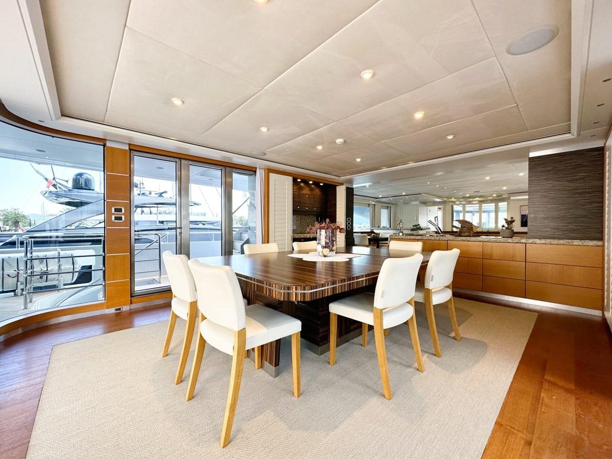 a large kitchen with a table and chairs aboard SHU U RITE Yacht for Sale