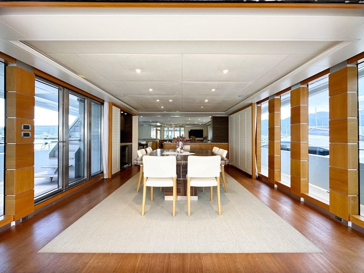 a room with a table and chairs aboard SHU U RITE Yacht for Sale