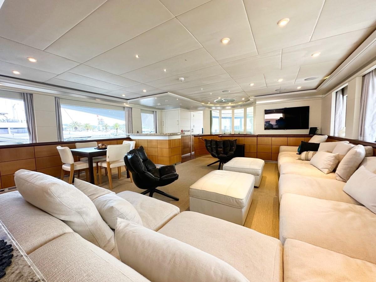 a living room with a couch and a table aboard SHU U RITE Yacht for Sale