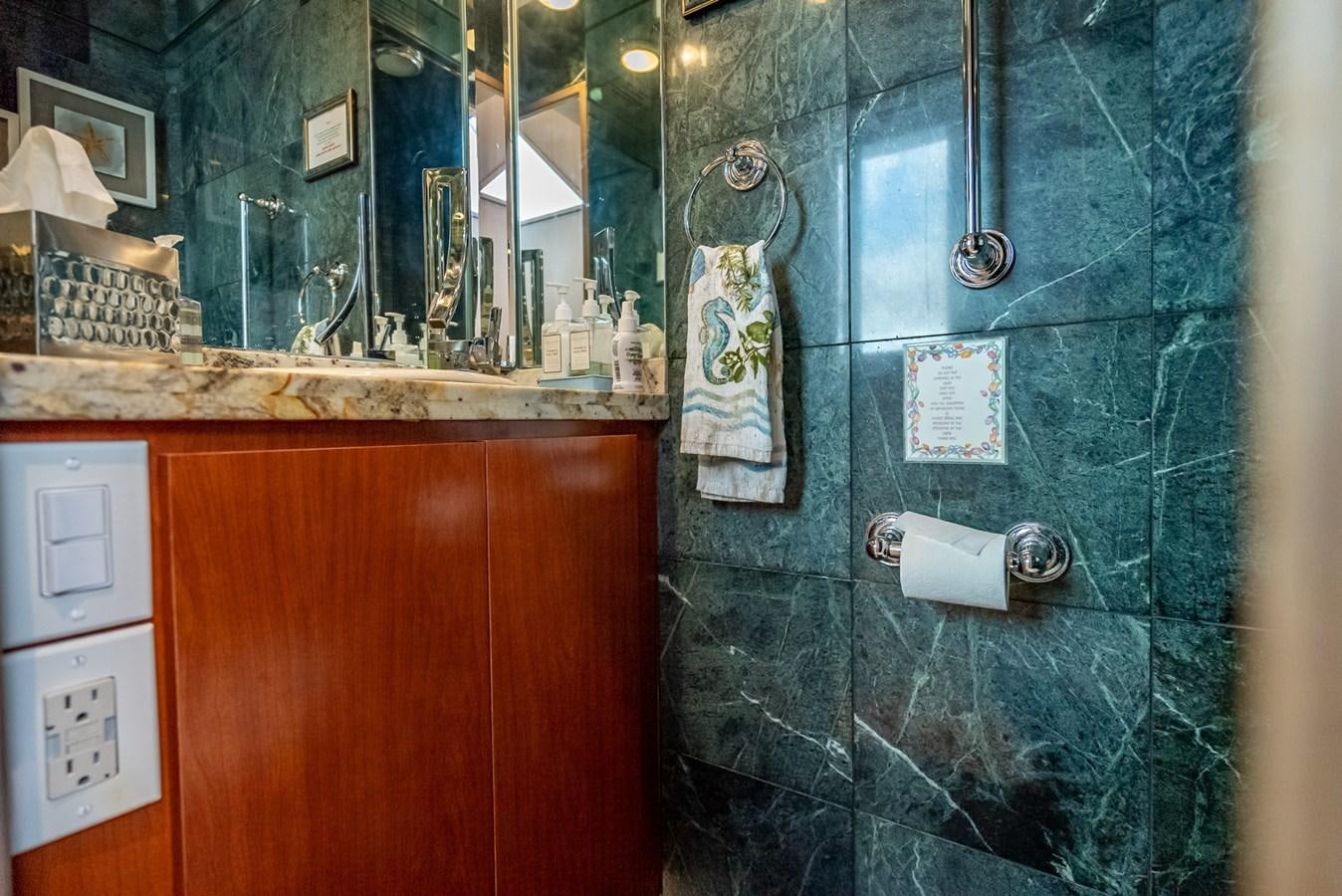 a bathroom with a shower curtain aboard MY WAY Yacht for Sale