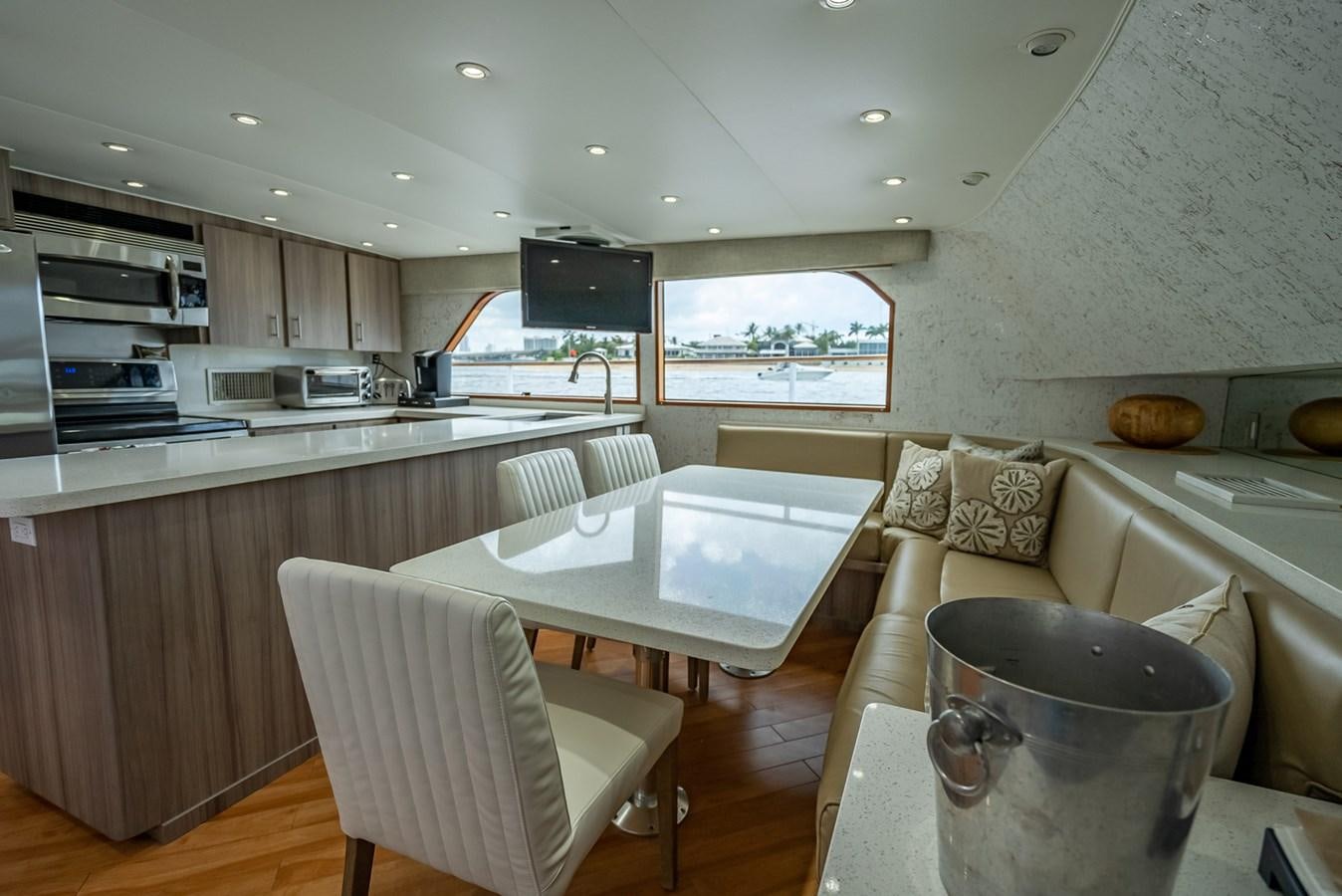 a kitchen with a table and chairs aboard MY WAY Yacht for Sale