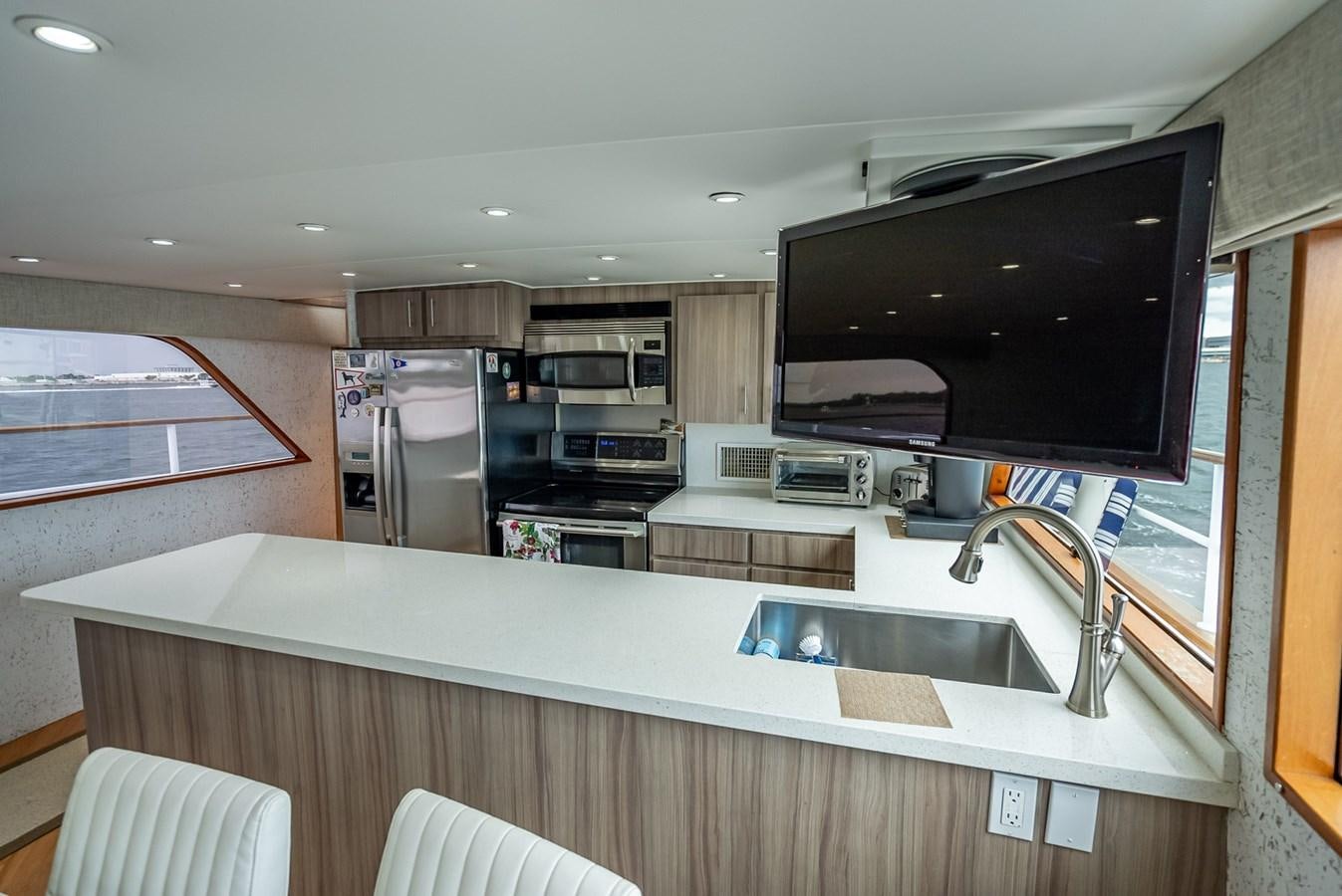 a kitchen with a large tv aboard MY WAY Yacht for Sale