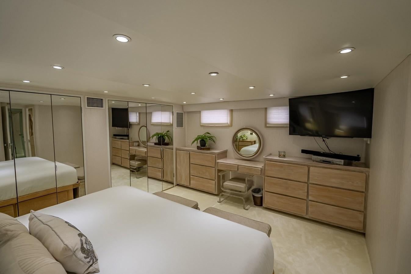 a bedroom with a large tv aboard MY WAY Yacht for Sale