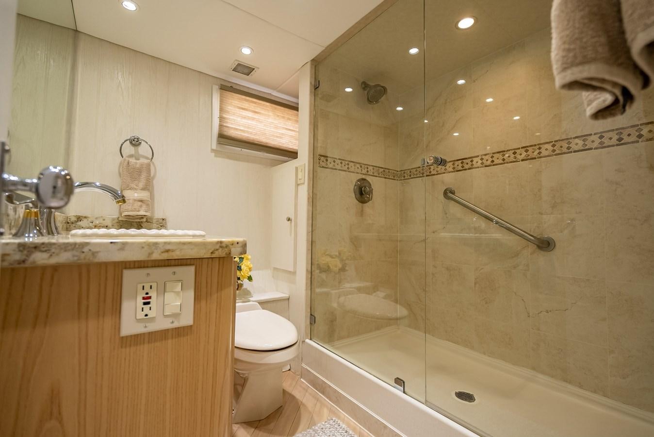 a bathroom with a glass shower aboard MY WAY Yacht for Sale