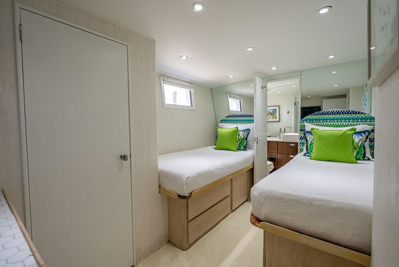 a bedroom with a bed and a closet aboard MY WAY Yacht for Sale