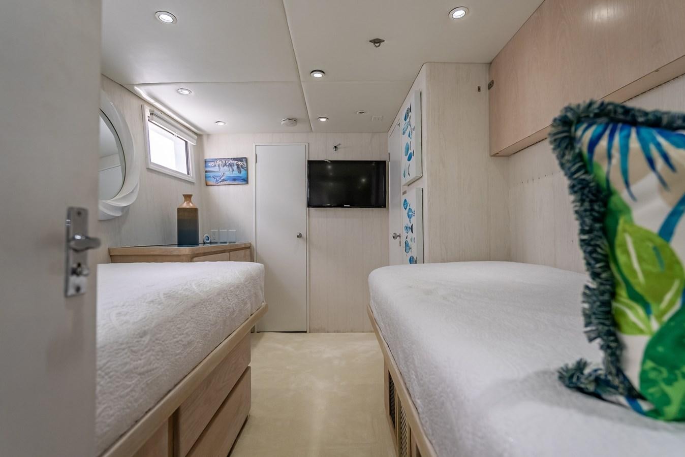 a room with a bed and a television aboard MY WAY Yacht for Sale