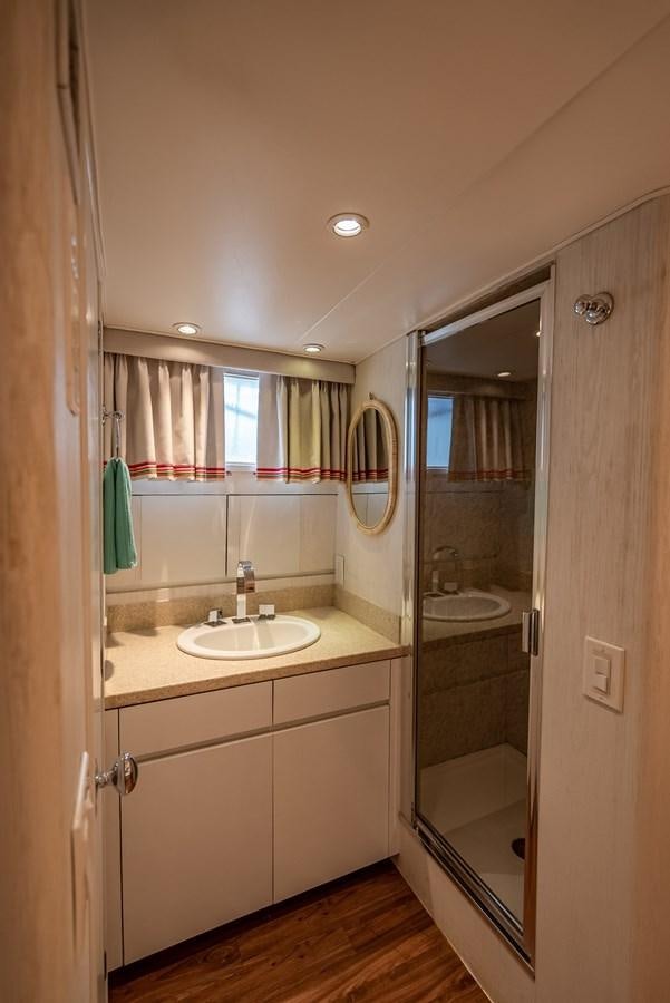 a bathroom with a sink and a mirror aboard MY WAY Yacht for Sale