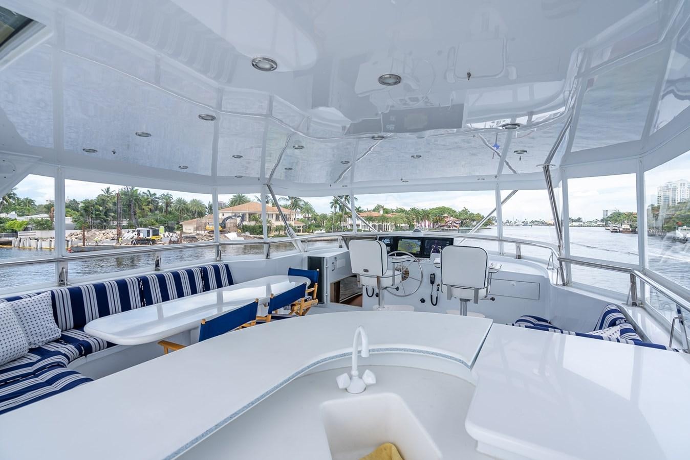 a room with a table and chairs aboard MY WAY Yacht for Sale