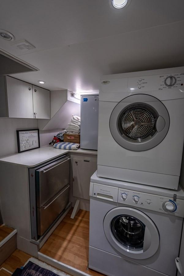 a laundry room with a washing machine aboard MY WAY Yacht for Sale