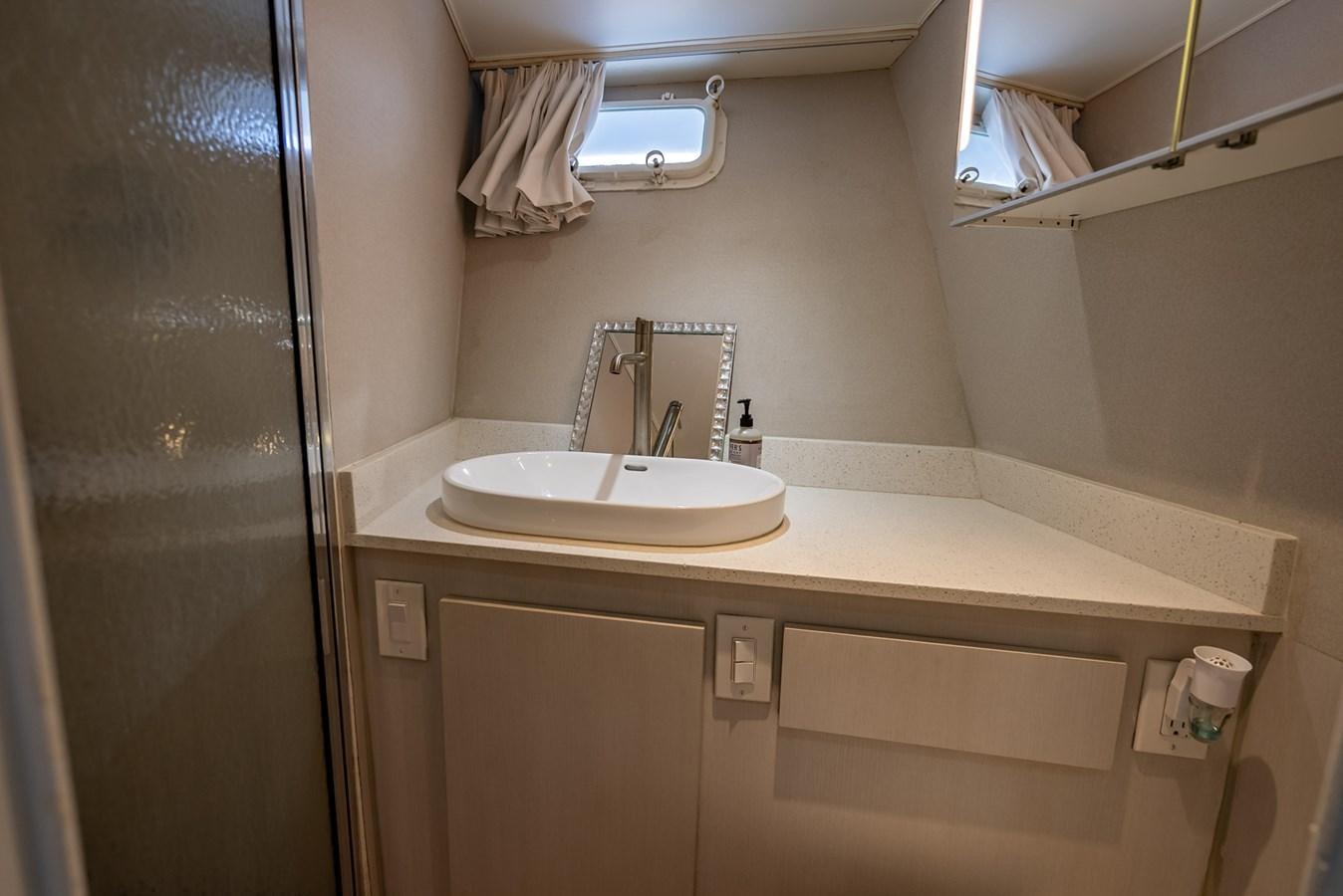 a bathroom with a sink and a mirror aboard MY WAY Yacht for Sale