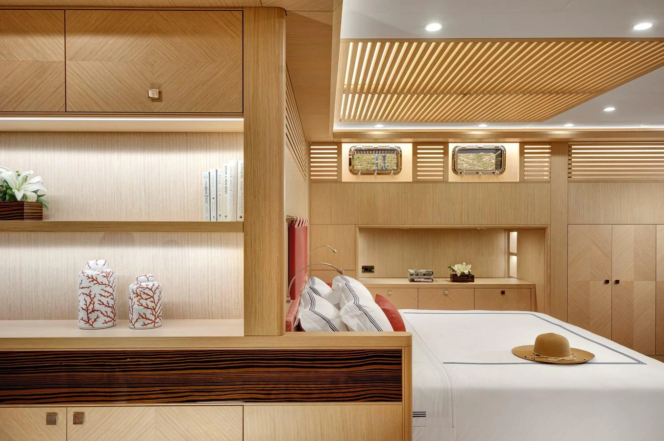 a room with a bed and a desk aboard THAT'S AMORE Yacht for Sale