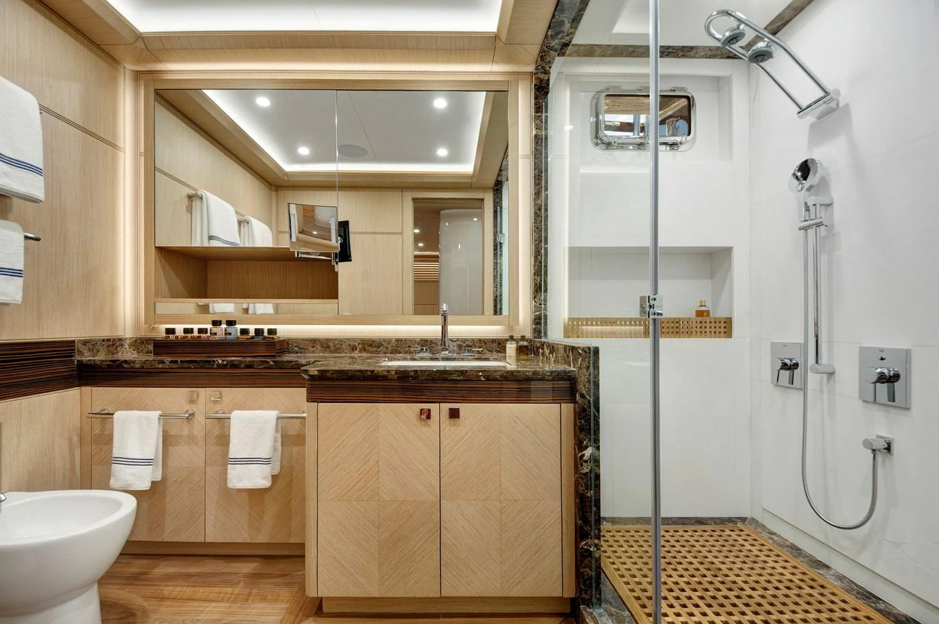 a bathroom with a sink and a shower unit aboard THAT'S AMORE Yacht for Sale