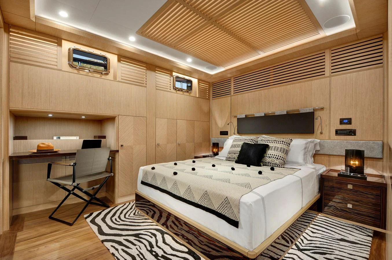 a large bedroom with a bed aboard THAT'S AMORE Yacht for Sale