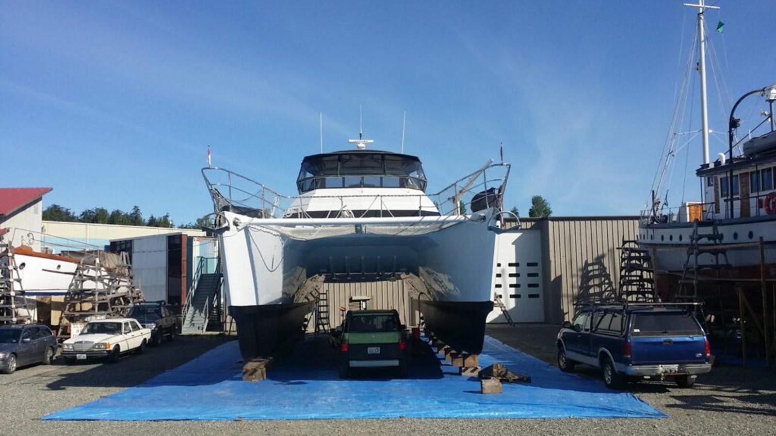 a large white boat docked aboard AWESOME Yacht for Sale