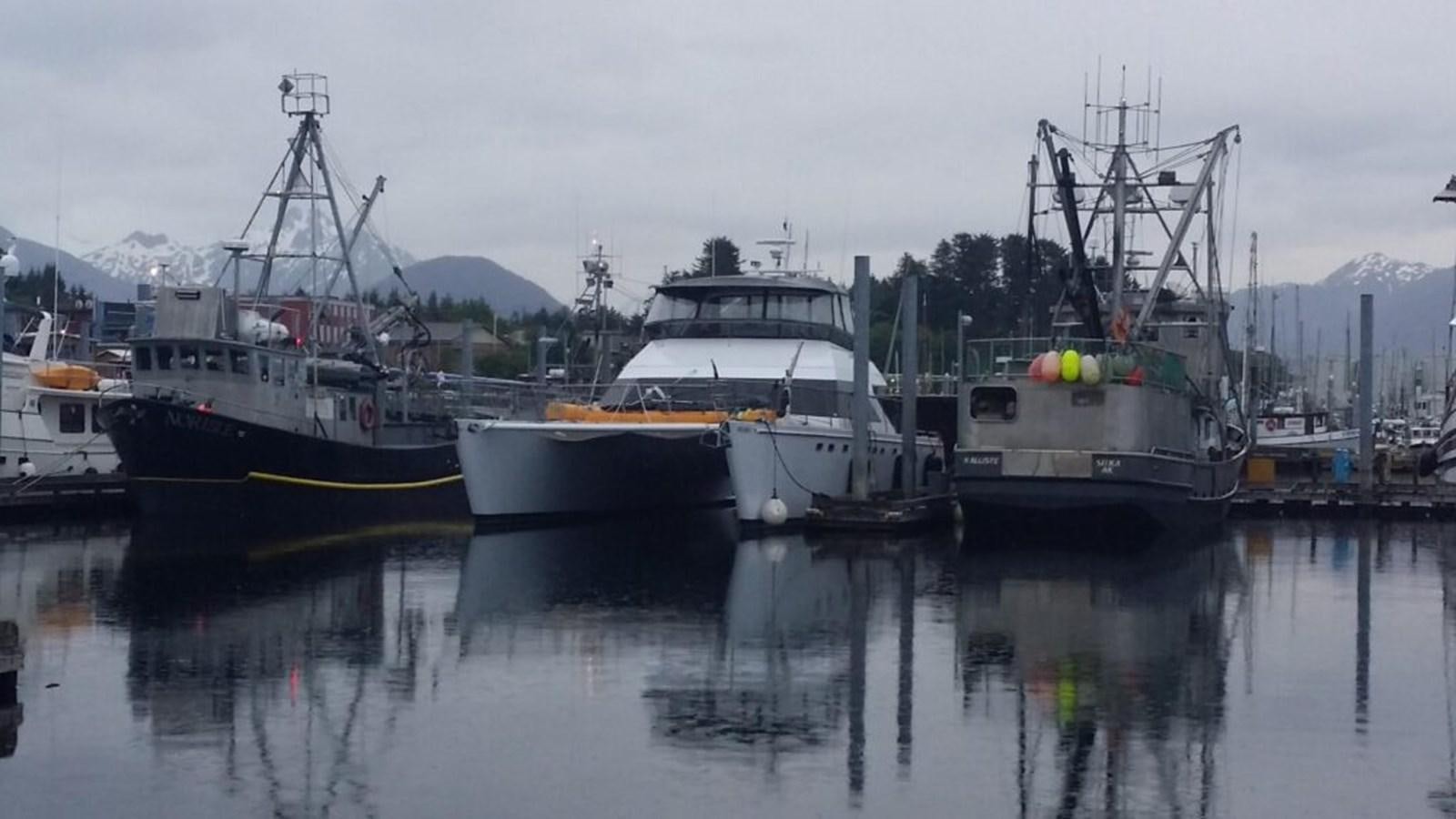 a group of boats sit in a harbor aboard AWESOME Yacht for Sale