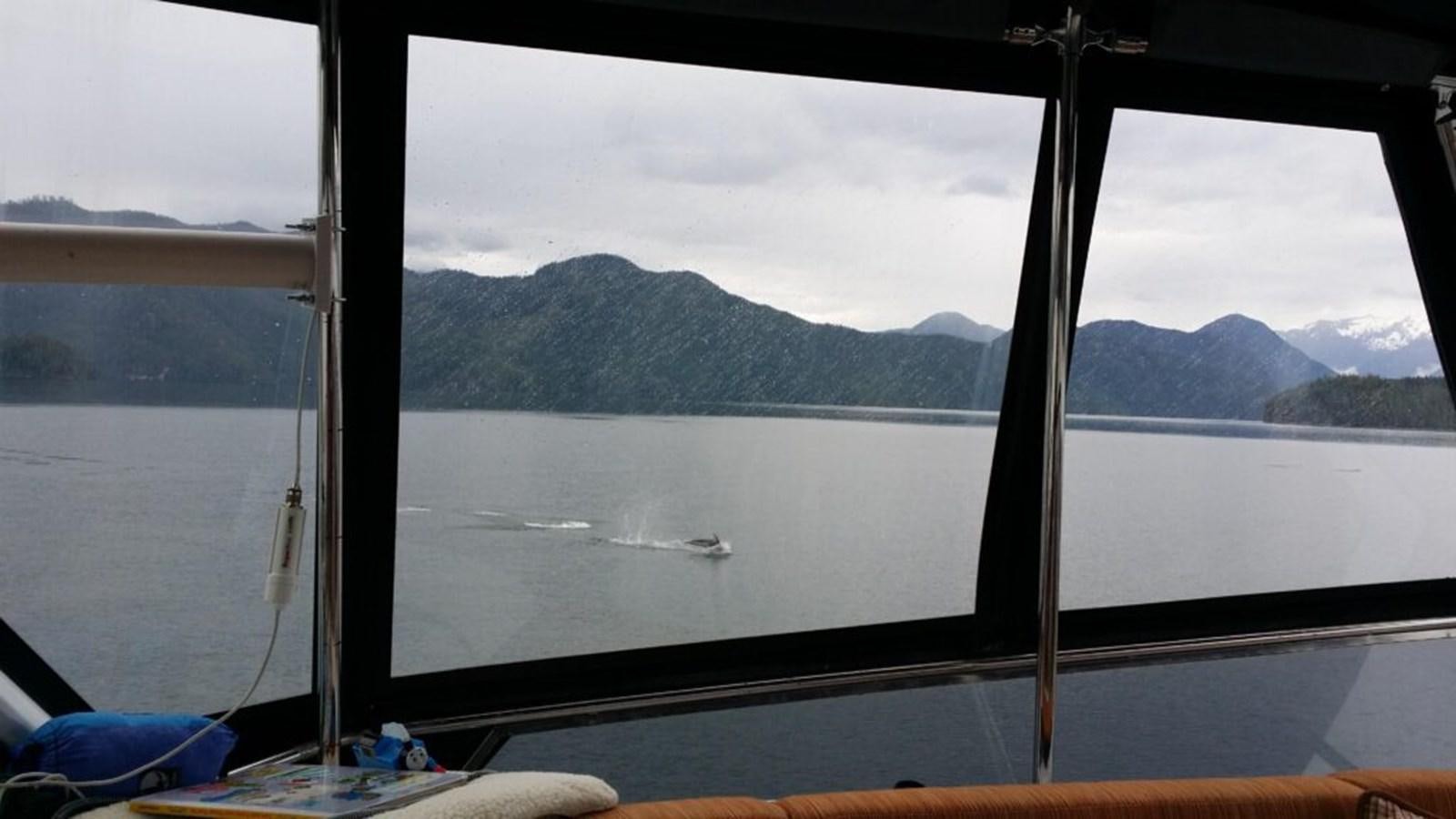 a large window overlooking a body of water aboard AWESOME Yacht for Sale