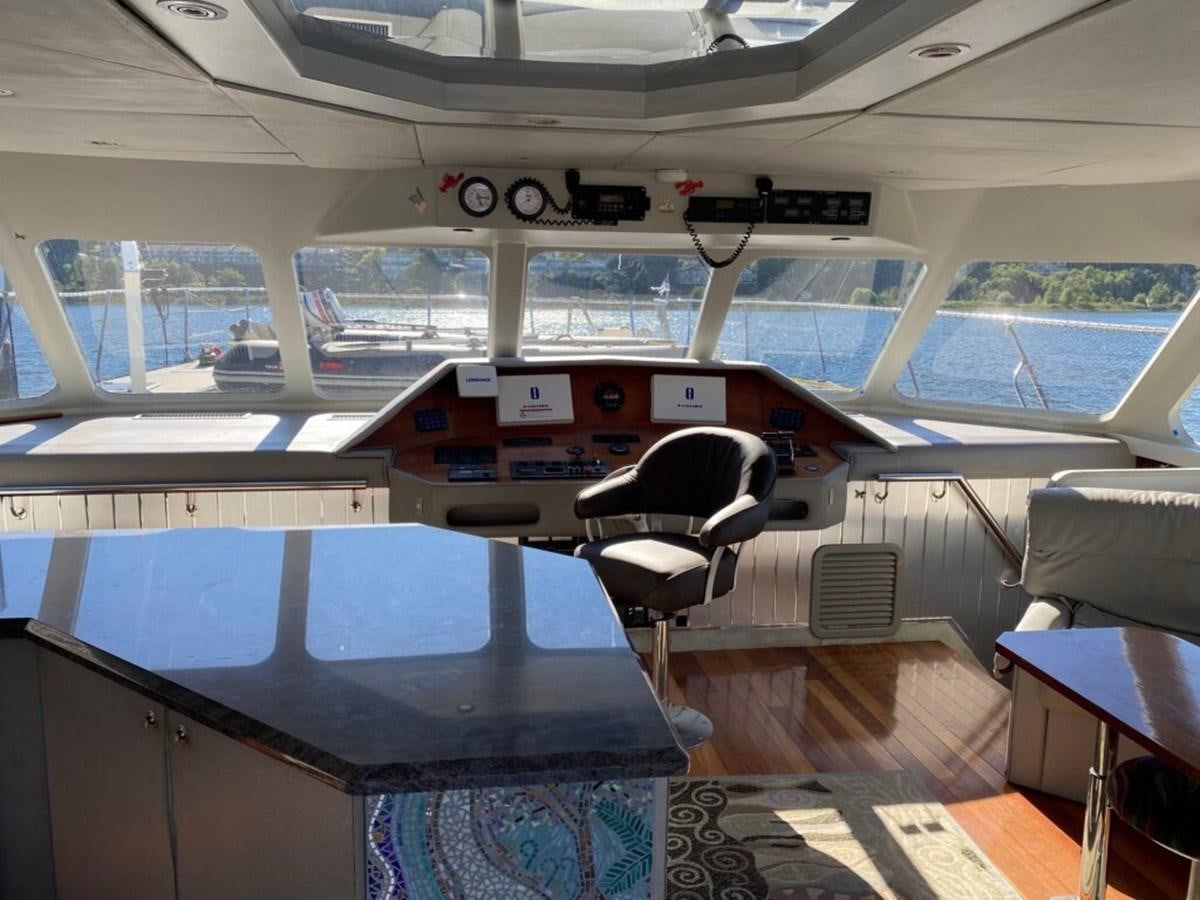 a room with a table and chairs aboard AWESOME Yacht for Sale