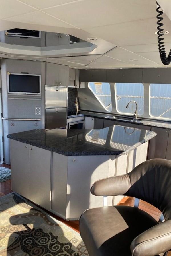 a kitchen with a large island aboard AWESOME Yacht for Sale