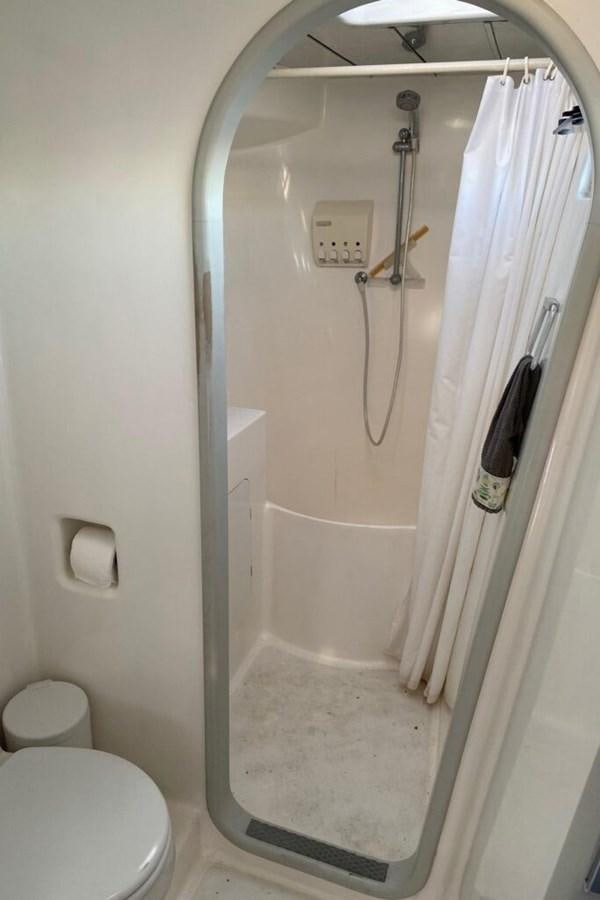 a shower with a shower curtain aboard AWESOME Yacht for Sale