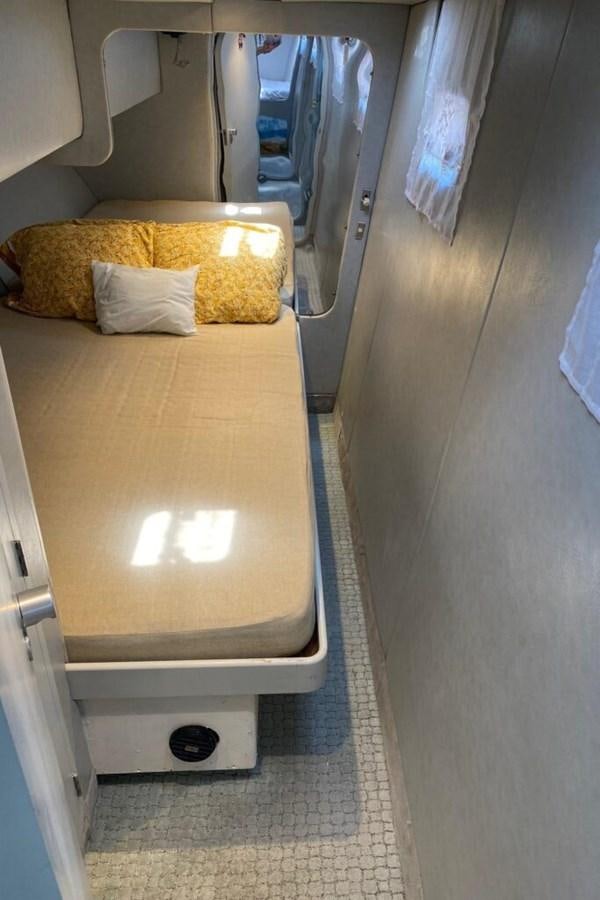 a bed in a room aboard AWESOME Yacht for Sale