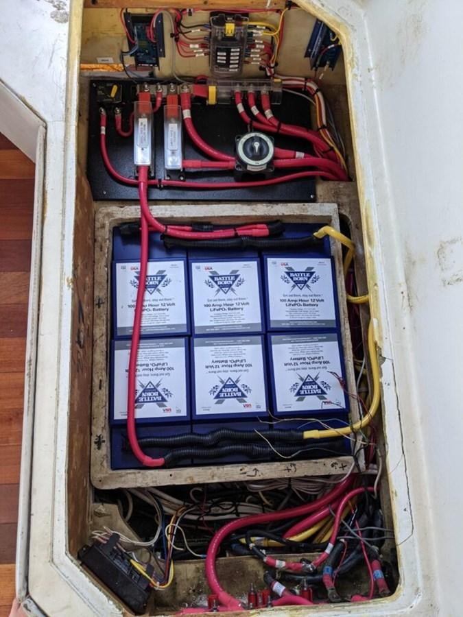 a computer with wires and cables aboard AWESOME Yacht for Sale