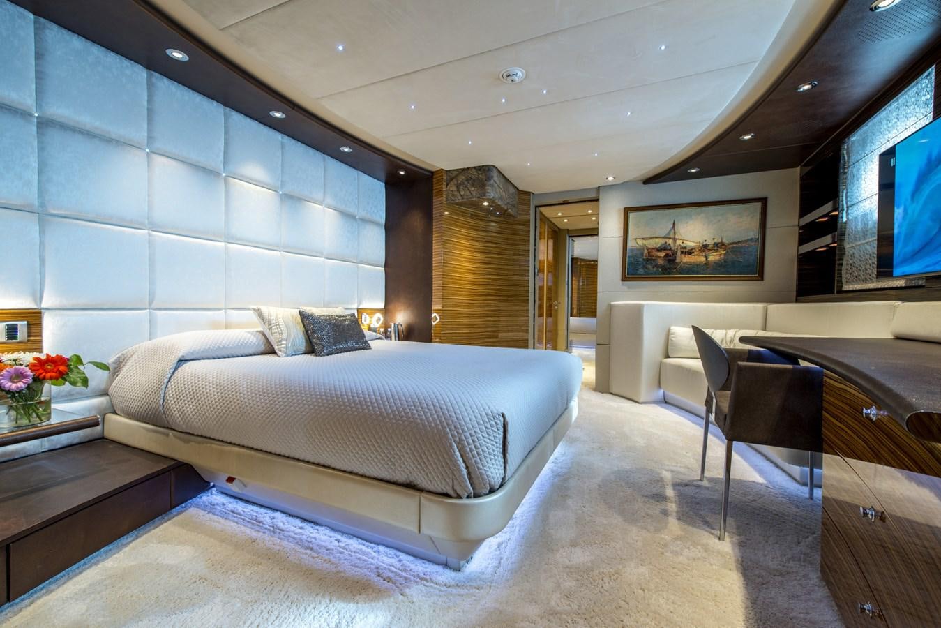 a large bedroom with a bed aboard TIAMAT Yacht for Sale