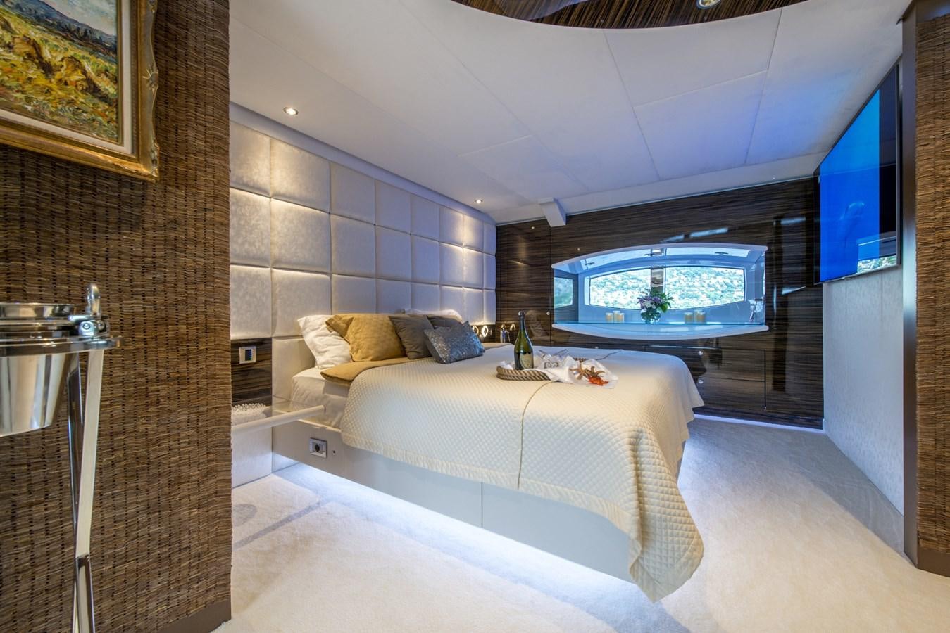 a room with a bed and a tv aboard TIAMAT Yacht for Sale