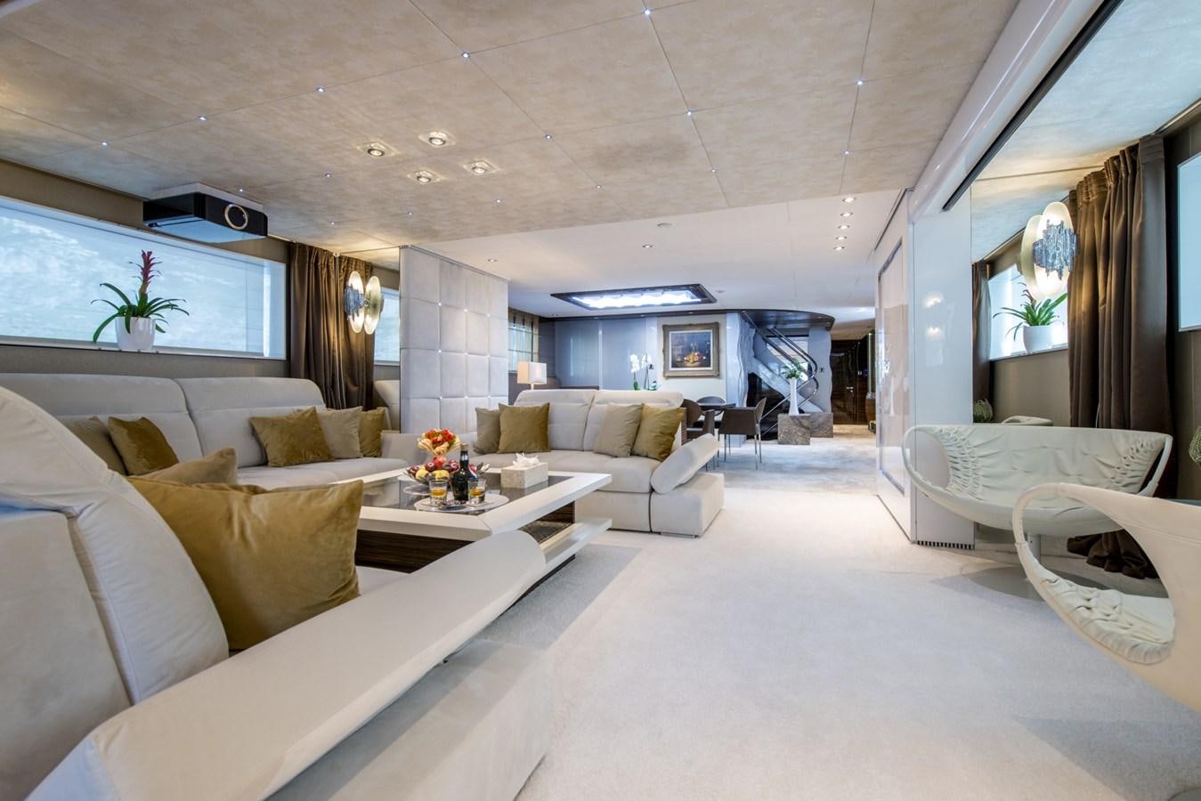 a living room with a couch and a table aboard TIAMAT Yacht for Sale